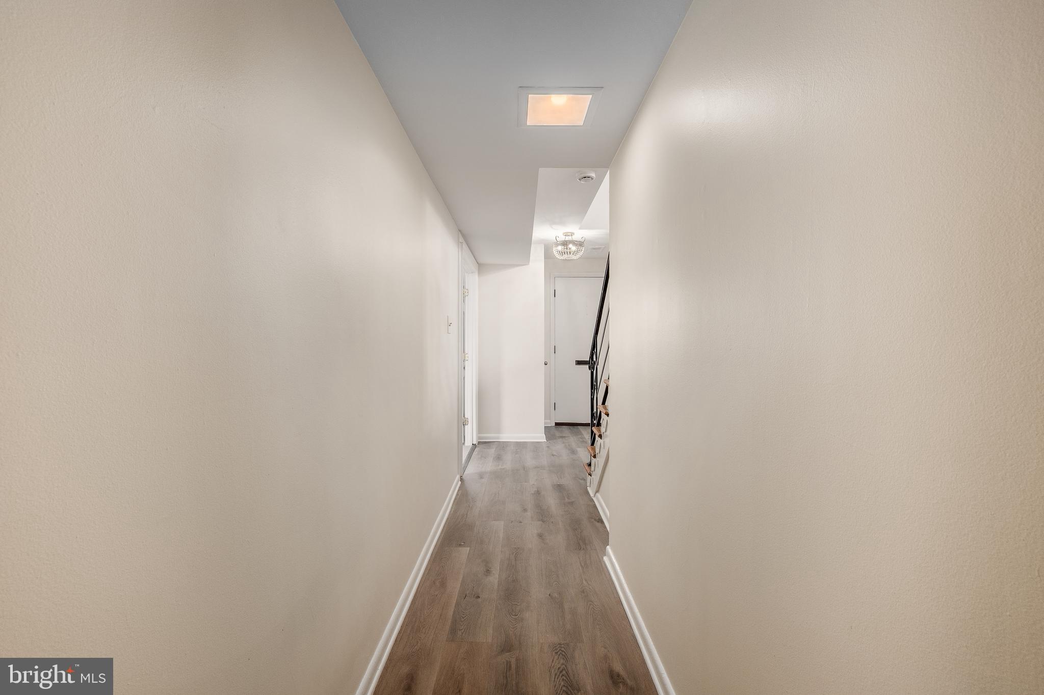 4208 16th Street Northwest Washington, DC 20011 - Photo 3 of 47 a view of a hallway with wooden floor and staircase