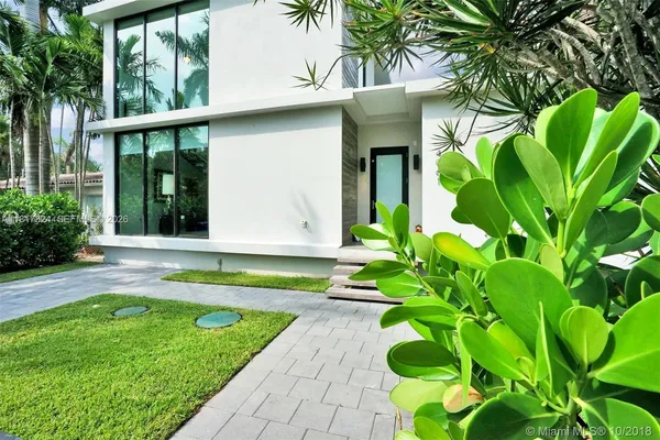 a house with a yard in front of it
