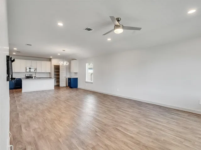 a view of a kitchen with a sink and cabinet