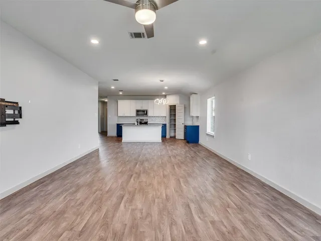a view of kitchen and refrigerator