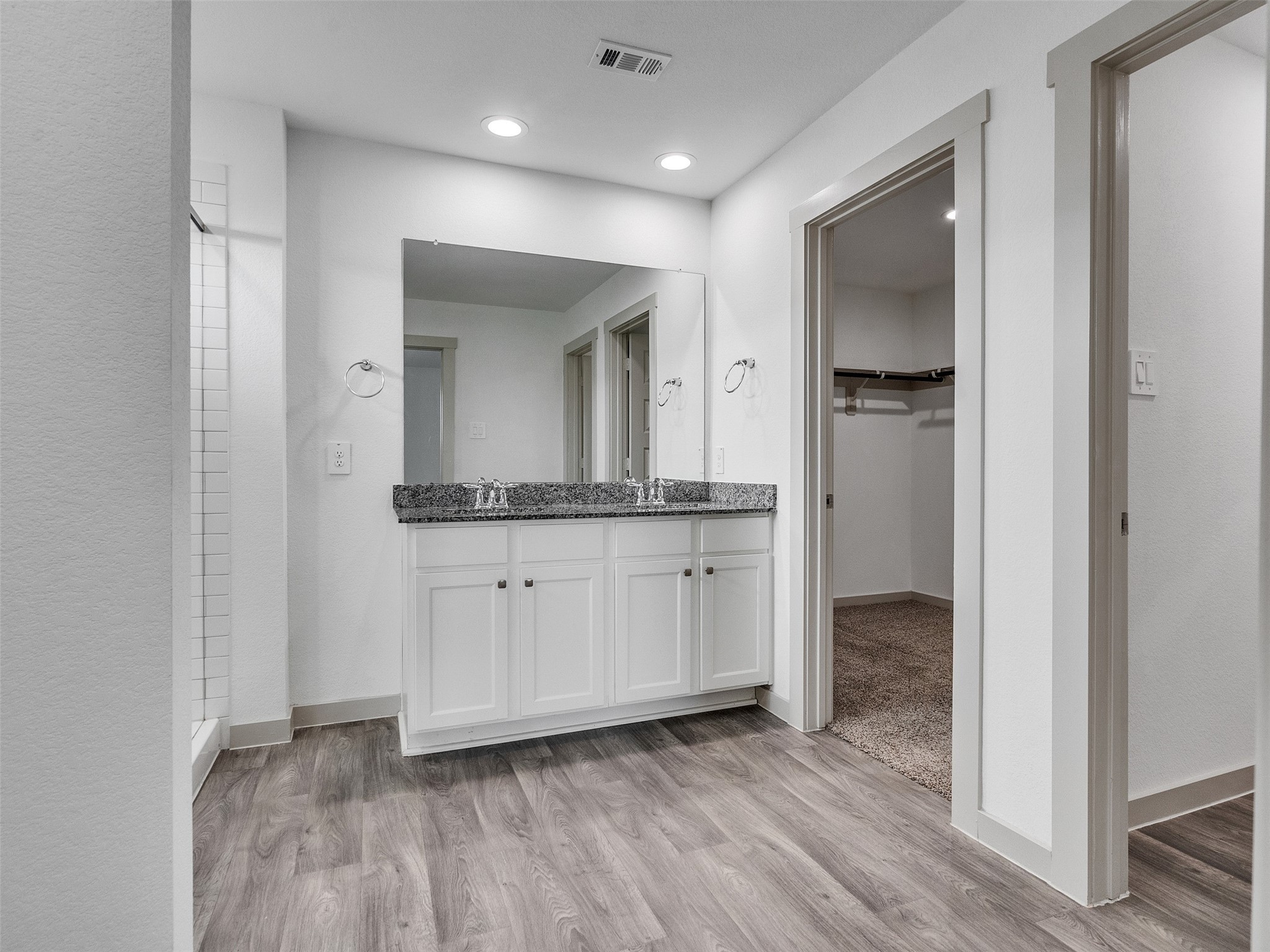 10627 Great Basin Drive Rosharon, TX 77583 - Photo 20 of 42 a bathroom with a granite countertop sink and a mirror