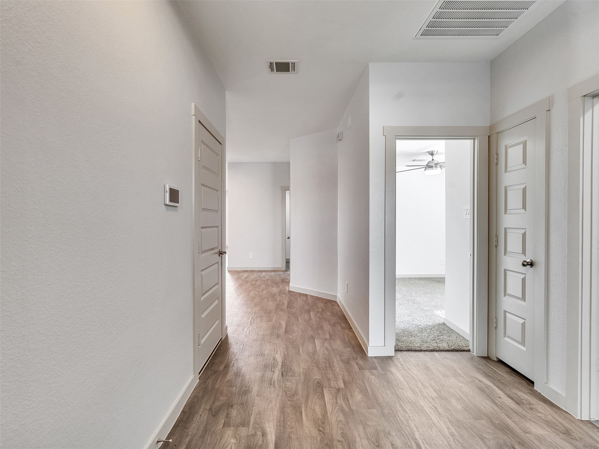 10627 Great Basin Drive Rosharon, TX 77583 - Photo 23 of 42 a view of a hallway with wooden floor