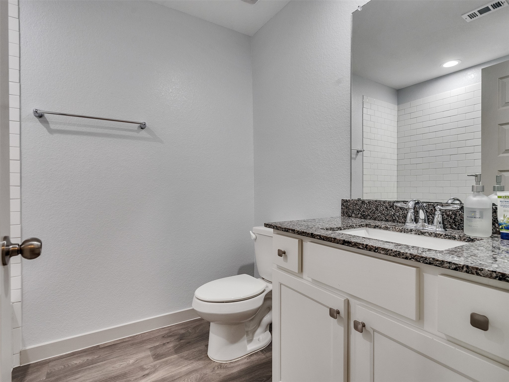 10627 Great Basin Drive Rosharon, TX 77583 - Photo 25 of 42 a bathroom with a granite countertop toilet and sink