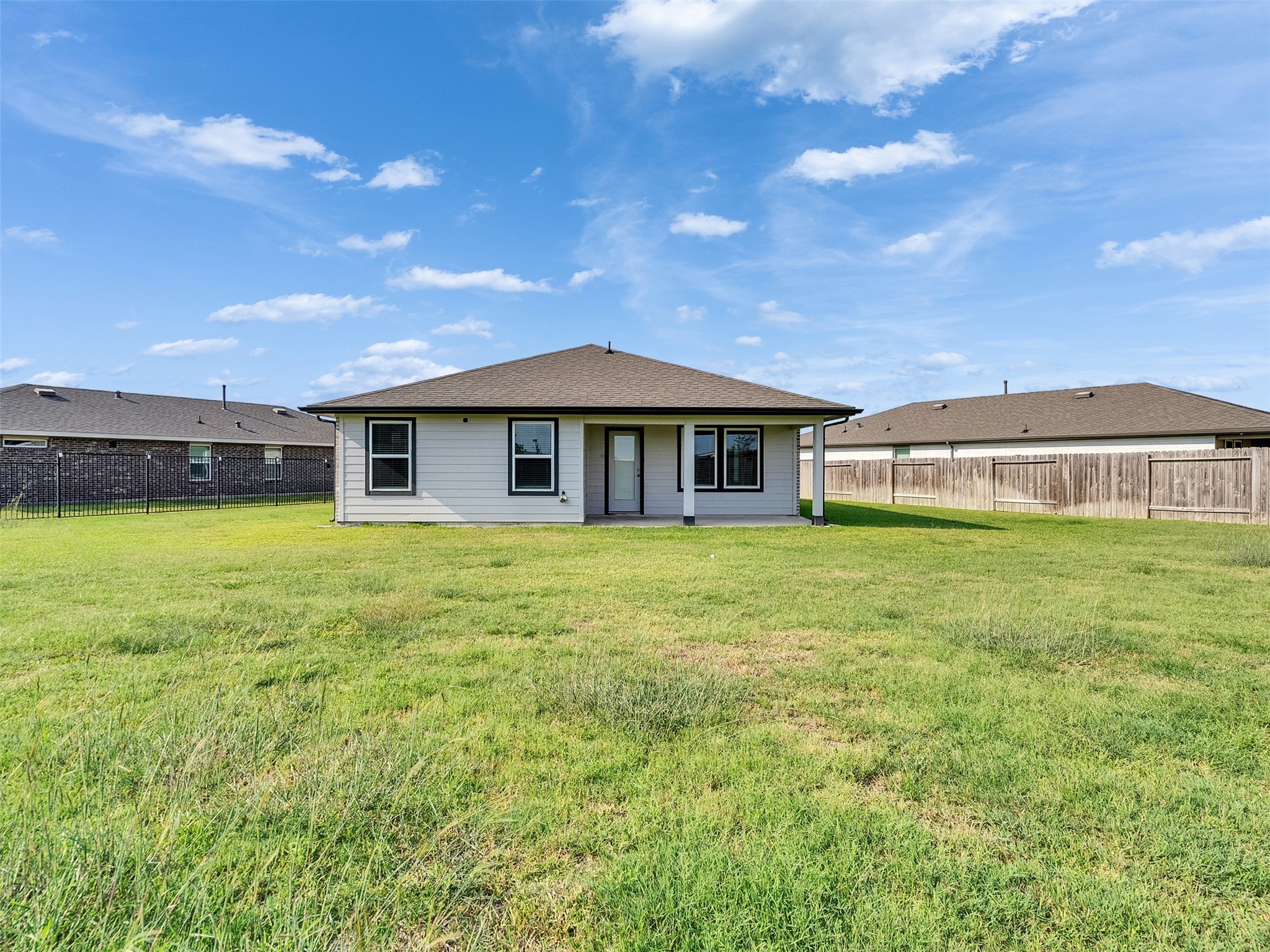 10627 Great Basin Drive Rosharon, TX 77583 - Photo 30 of 42 a front view of a house with a garden