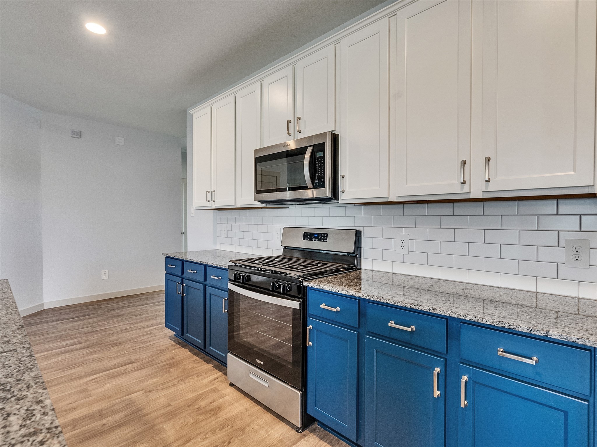 10627 Great Basin Drive Rosharon, TX 77583 - Photo 10 of 42 a kitchen with granite countertop wooden cabinets and a stove top oven