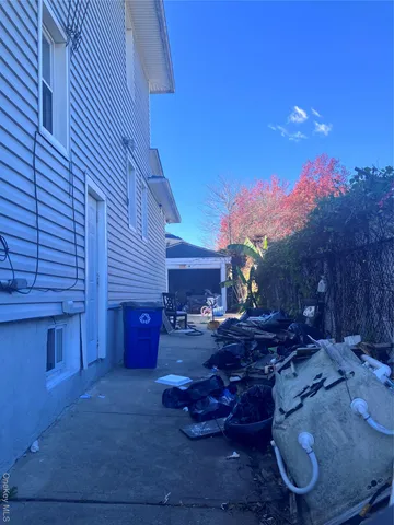 a view of a backyard with large trees