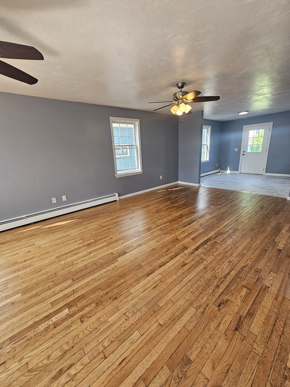 40 Merrick Street, Unit A Worcester, MA 01609 - Photo 14 of 32 a view of an empty room with window and wooden floor