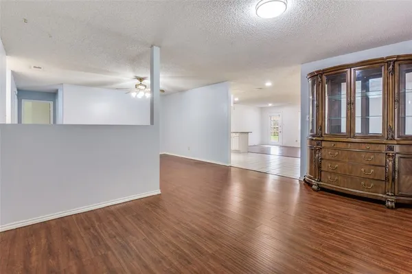 a view of a livingroom with wooden floor