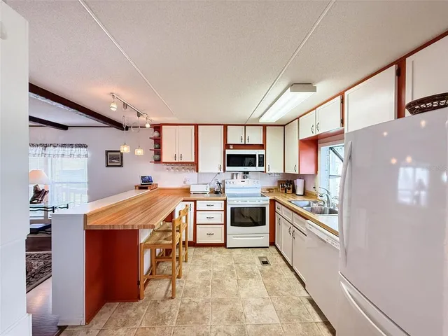 a view of a dining room with furniture and window