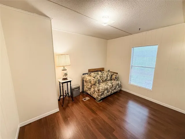 a picture of a table and chairs in the patio
