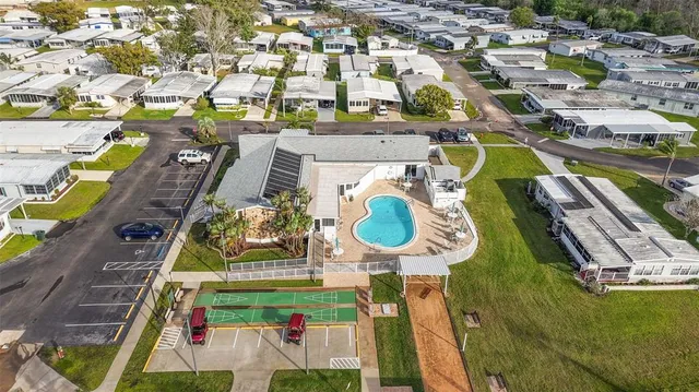 an aerial view of a house with a swimming pool