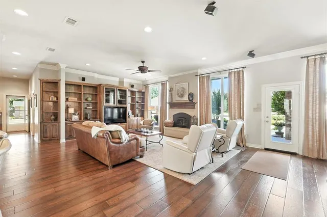 a living room with furniture a dining table and chairs