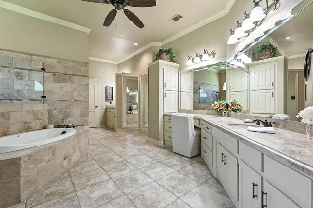 a large bathroom with a sink mirror and shower