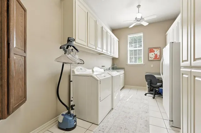 a view of entryway with workspace and windows