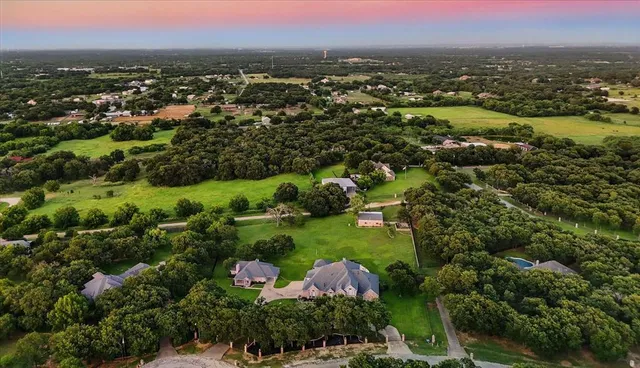 an aerial view of residential house with outdoor space