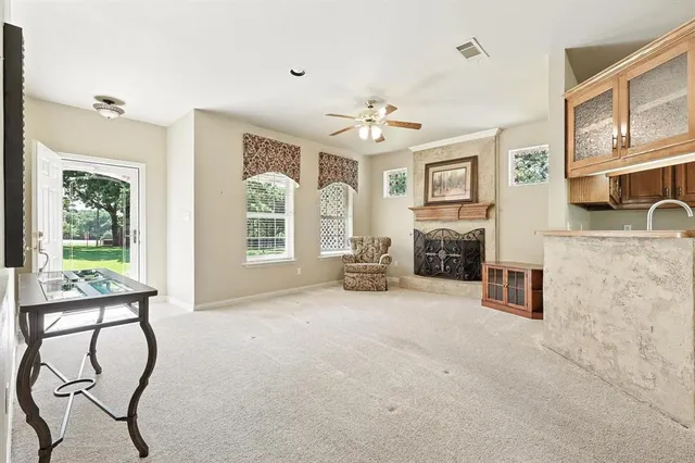 a kitchen with granite countertop a sink appliances a counter space and cabinets