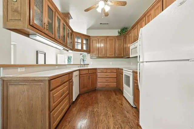 a house view with a sitting space and garden