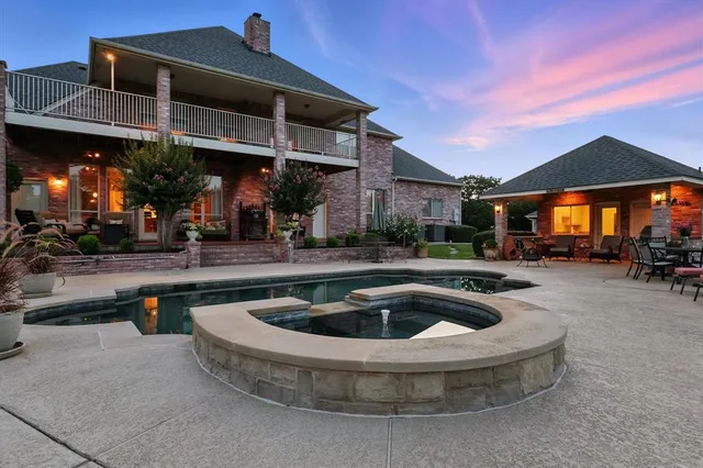 a view of a chairs and table in patio