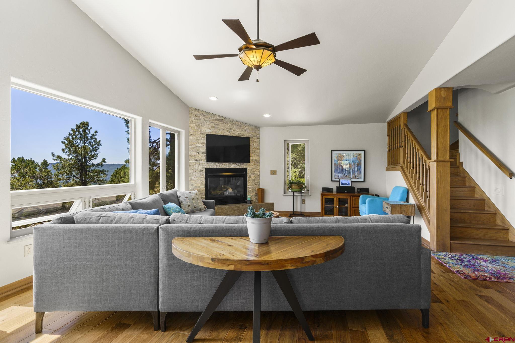 1680 Ridge Road Durango, CO 81303 - Photo 10 of 29 a living room with furniture and a fireplace