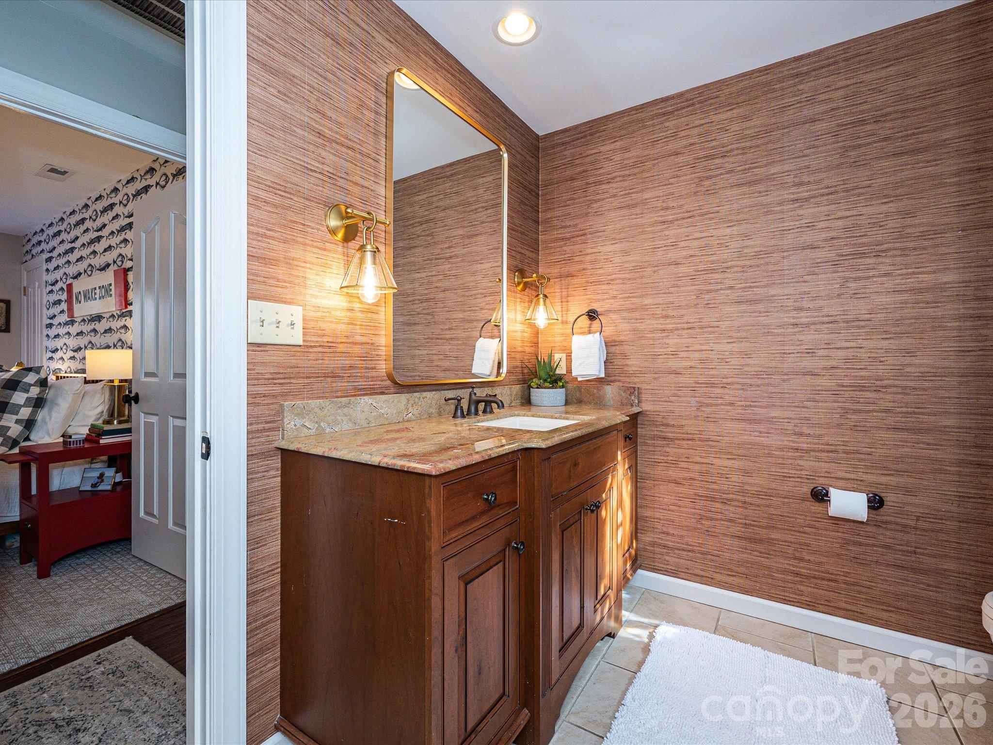 4540 Forest Cove Road Belmont, NC 28012 - Photo 23 of 46 a bathroom with a granite countertop sink and a mirror