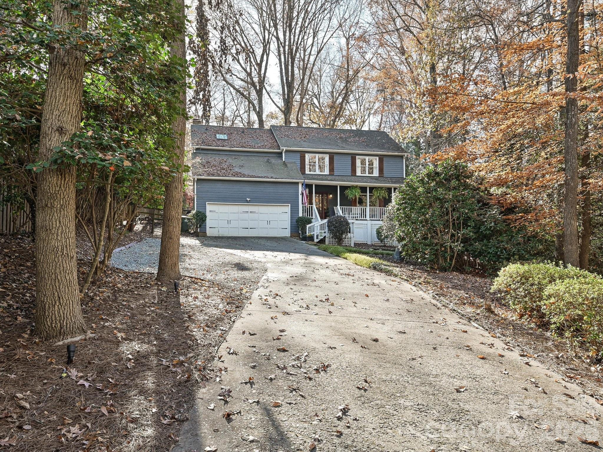 4540 Forest Cove Road Belmont, NC 28012 - Photo 45 of 46 a front view of a house with a yard covered with snow