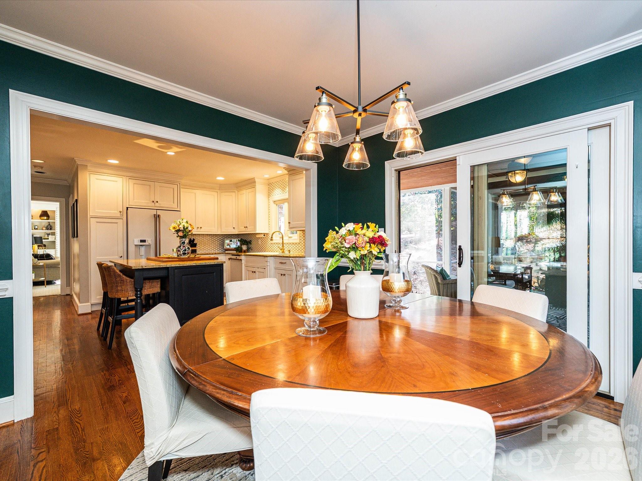4540 Forest Cove Road Belmont, NC 28012 - Photo 5 of 46 a dining room with furniture a large window and chandelier