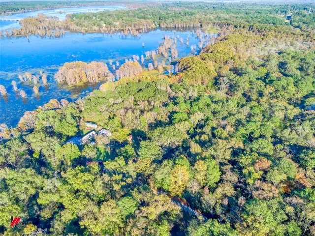 a view of ocean with green space