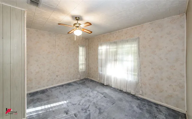 a view of an empty room with a window