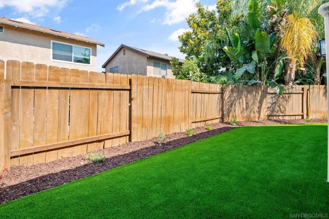 a view of a house with backyard porch and sitting area