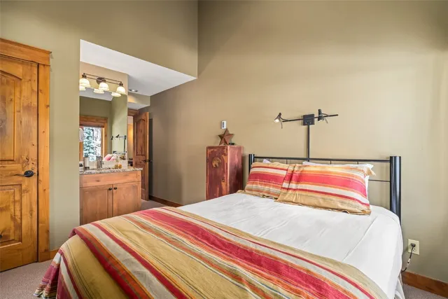 a white bath tub sitting next to a white sink and vanity