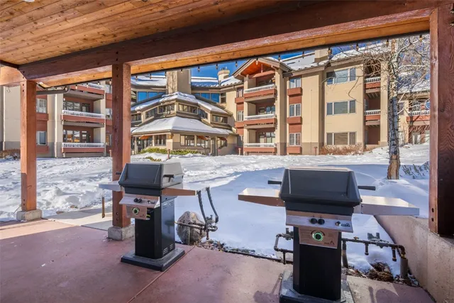 a front view of a house with a yard table and chairs