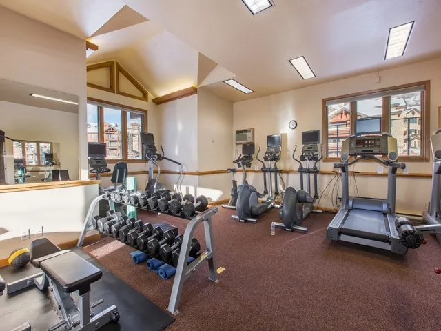 a table and chairs in front of a house
