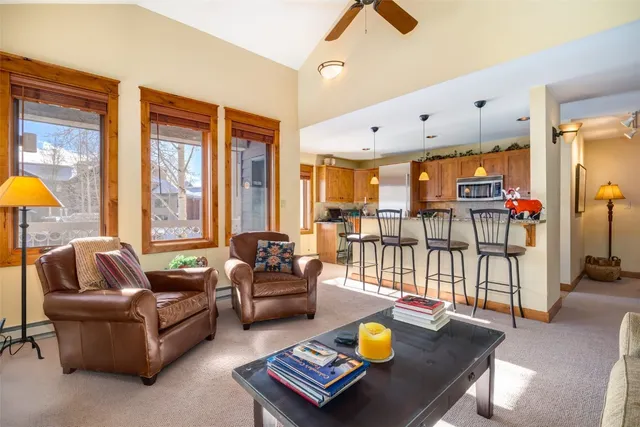 a living room with furniture and a table
