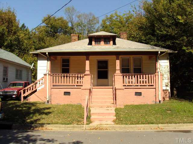 313 East Lee Street Raleigh, NC 27601 - Photo 1 of 8 a front view of a house with a yard