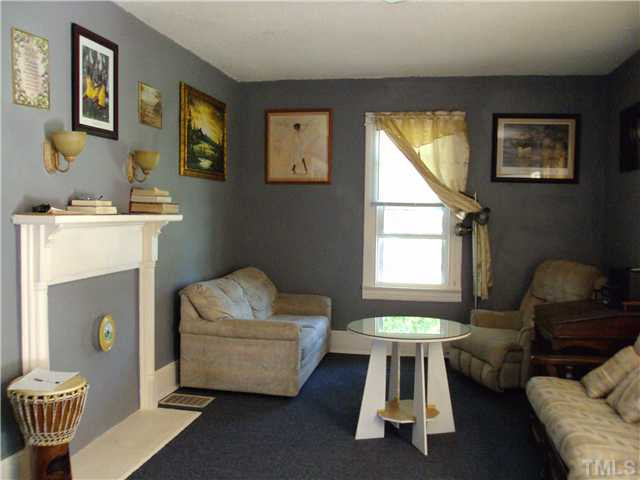 313 East Lee Street Raleigh, NC 27601 - Photo 3 of 8 a living room with furniture and a window