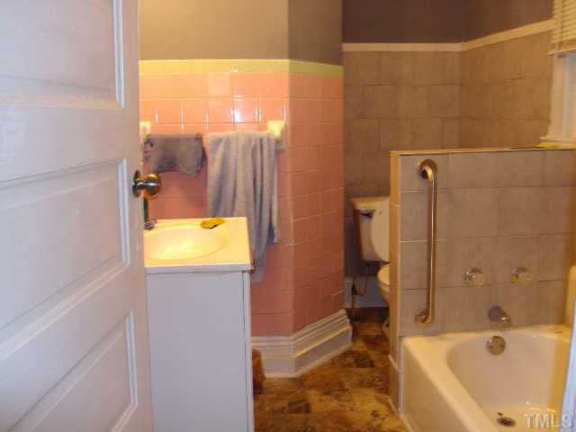 313 East Lee Street Raleigh, NC 27601 - Photo 5 of 8 a bathroom with a tub and shower