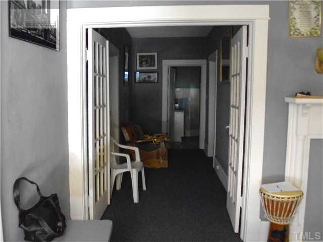 313 East Lee Street Raleigh, NC 27601 - Photo 8 of 8 a view of a hallway with workspace and living room