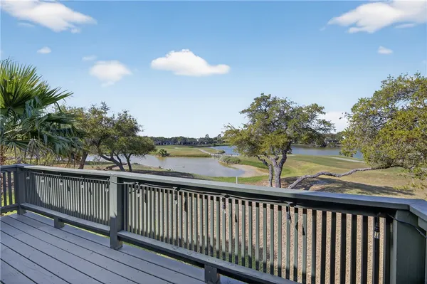 a view of balcony with wooden floor