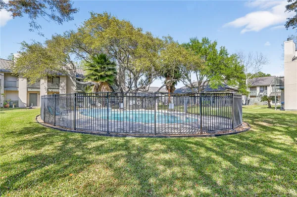 a view of a swimming pool with a backyard