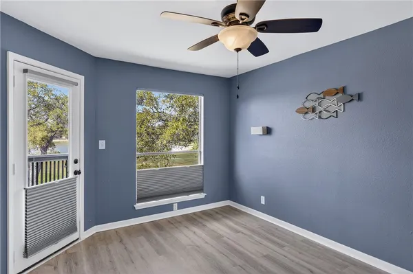 a view of an empty room with a window