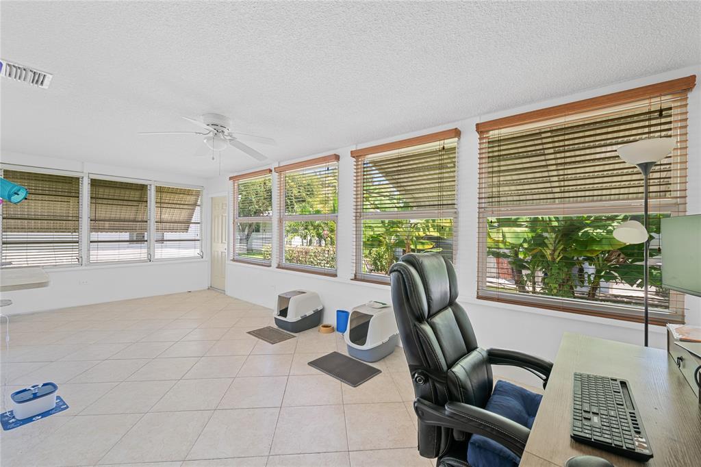 220 South Golf Boulevard Pompano Beach, FL 33064 - Photo 11 of 35 a view of a workspace with furniture and a window