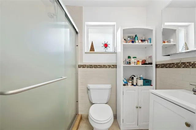 a bathroom with a toilet and a sink