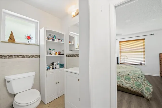 a bathroom with a toilet sink and vanity