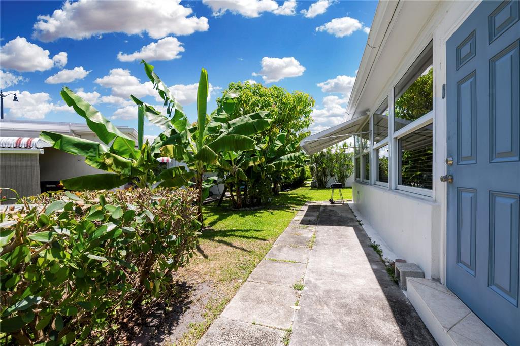 220 South Golf Boulevard Pompano Beach, FL 33064 - Photo 22 of 35 a view of yard with seating area