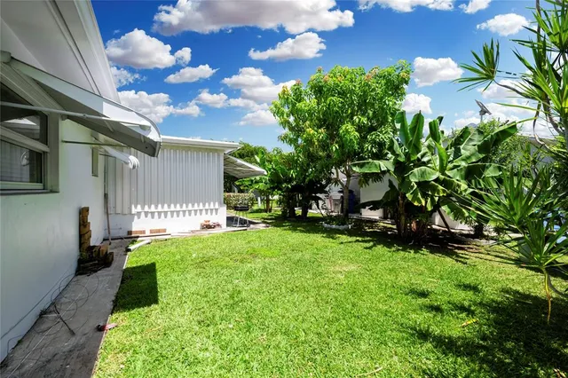 a backyard of a house with lots of green space