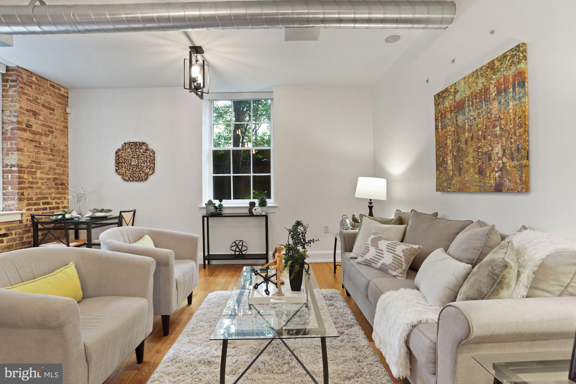 215 I Street Northeast, Unit 109 Washington, DC 20002 - Photo 1 of 33 Sunny, open living room