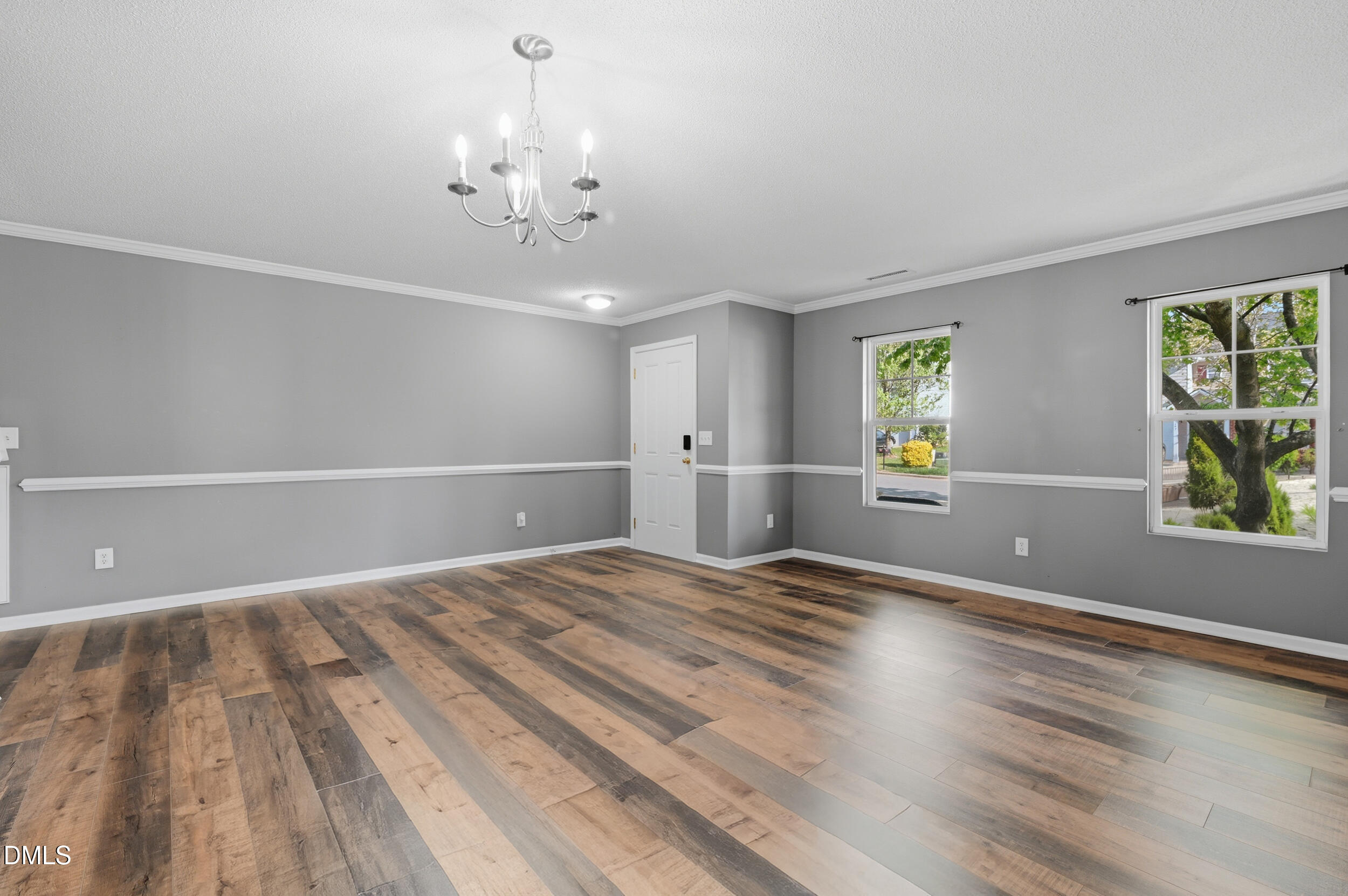 148 Brockton Ridge Drive Garner, NC 27529 - Photo 7 of 39 a view of empty room with wooden floor and fan