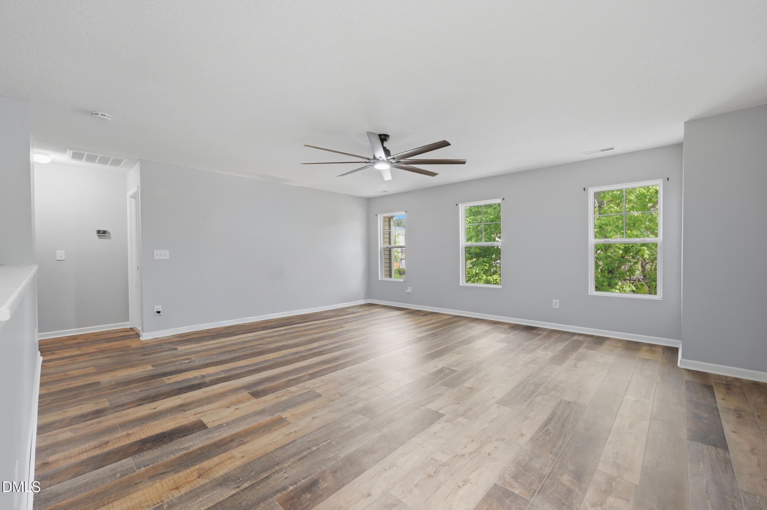 148 Brockton Ridge Drive Garner, NC 27529 - Photo 16 of 39 wooden floor in an empty room with a window