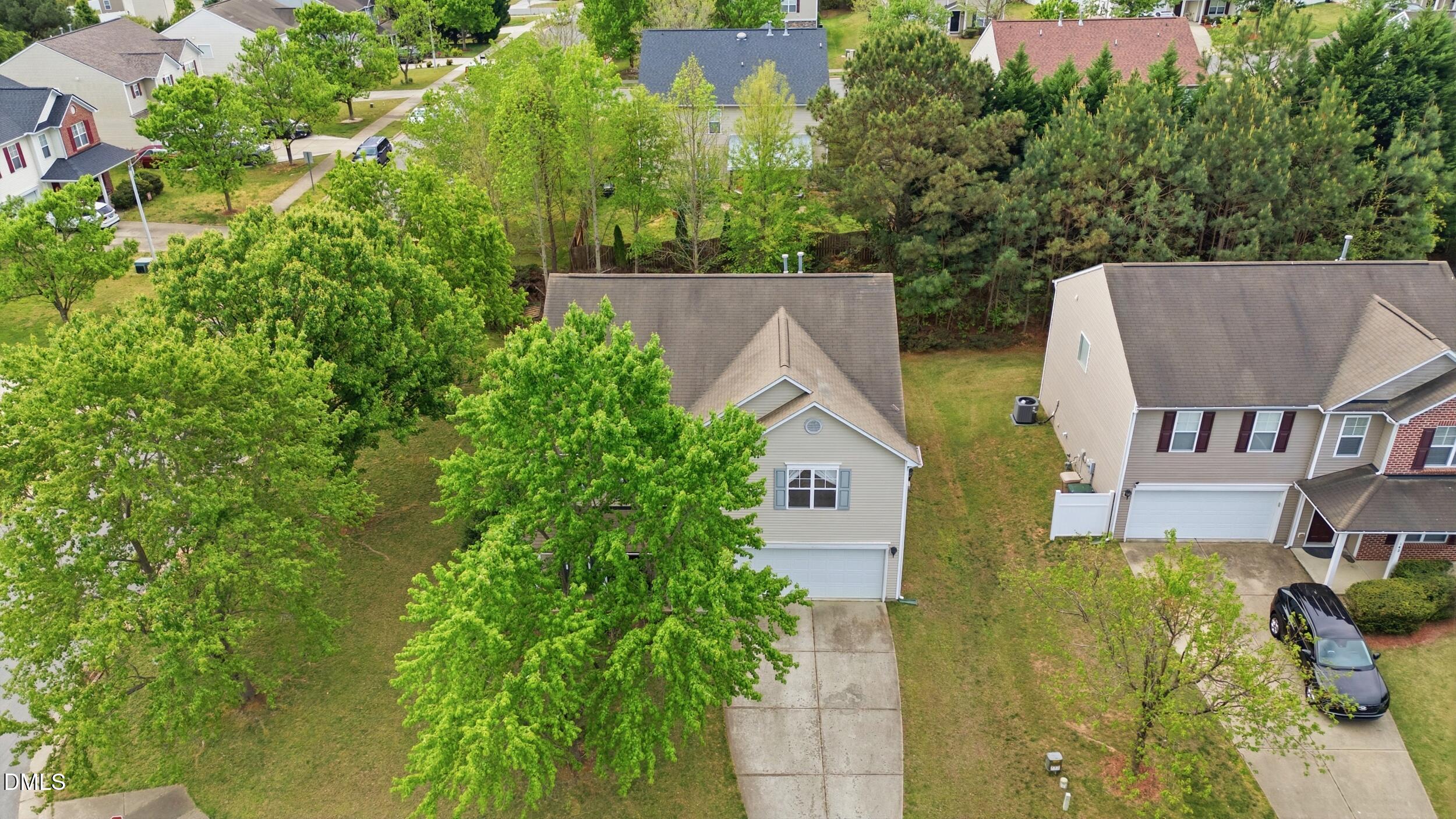 148 Brockton Ridge Drive Garner, NC 27529 - Photo 28 of 39 an aerial view of a house with swimming pool and garden
