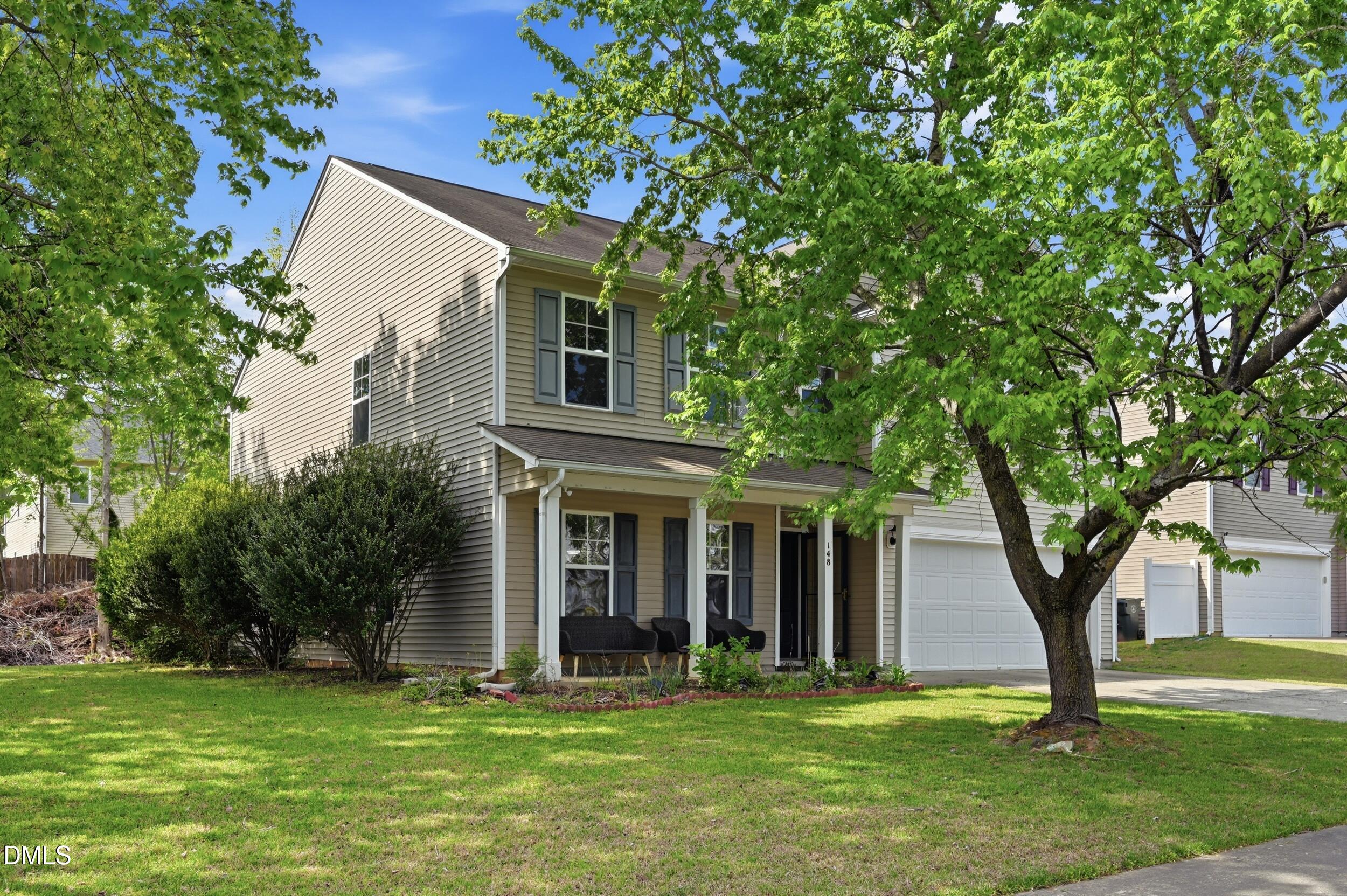 148 Brockton Ridge Drive Garner, NC 27529 - Photo 3 of 39 a front view of a house with a yard